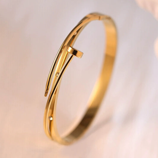 Gold nail statement bangle